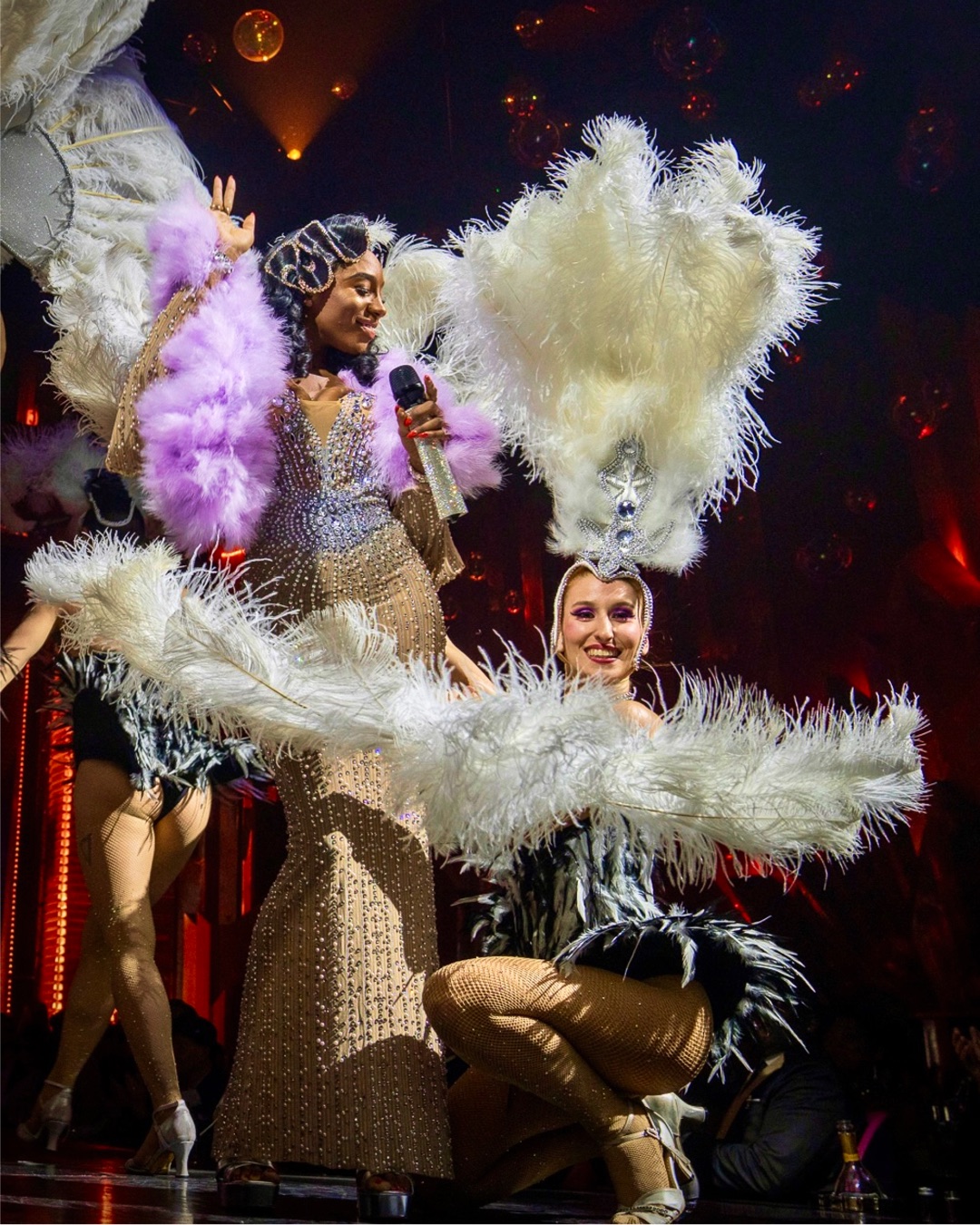 Circensia cabaret performers in feathered costumes