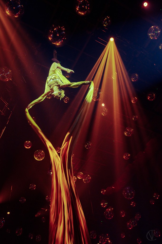 Young aerial artist training in a professional performance environment